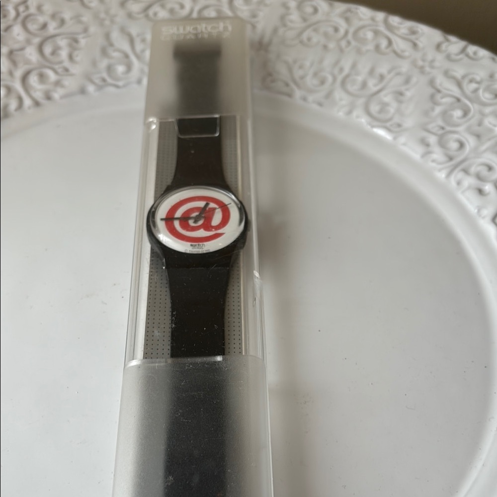 Swatch Black Watch with Red and White Spiral Dial